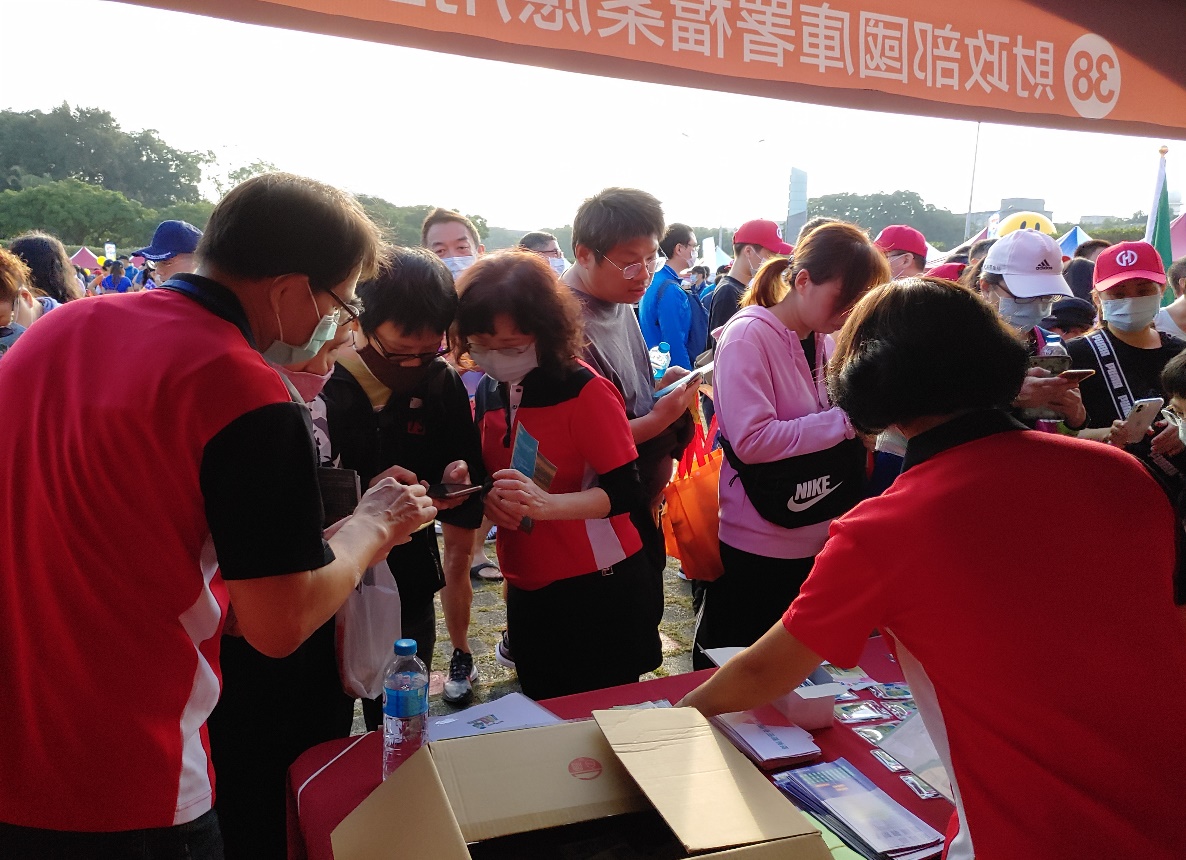 Picture: Staff hands out leaflets and mementos to promote archive access during the road running activity. 